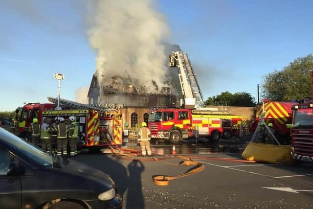Firefighters working to extinguish the fire at Hobby Fish in May last year. Photo: Cameron Walton/Northants On Blues
