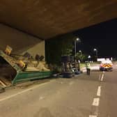 A lorry overturned after hitting Wooldale Road Bridge in the early hours of this morning.