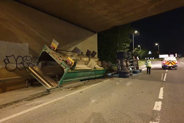 A lorry overturned after hitting Wooldale Road Bridge in the early hours of this morning.