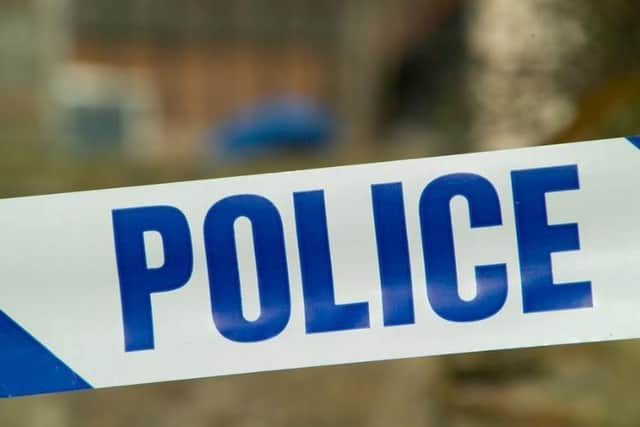 Police are holding a woman on suspicion of murder following last night's grisly discovery.