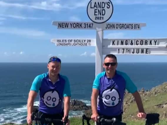 Ian Corkram and Jeff King at Lands End having cycled from Milton Keynes for Great Ormond Street Hospital