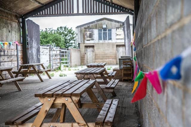 Elliotts' Rectory Farm's events space in an old barn, which also provides seating for the Brew caravan cafe. Photo: Kirsty Edmonds.