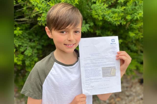 Dexter with his letter from Mensa.