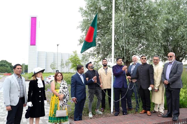 The Bangladeshi flag is raised surrounded by dignitaries at the event to celebrate 50 years of the country's indepedence at the University of Northampton's Waterside campus