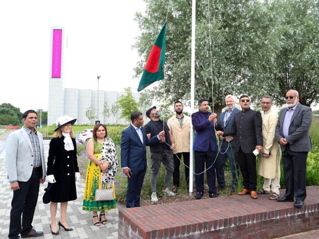 The Bangladeshi flag is raised surrounded by dignitaries at the event to celebrate 50 years of the country's indepedence at the University of Northampton's Waterside campus