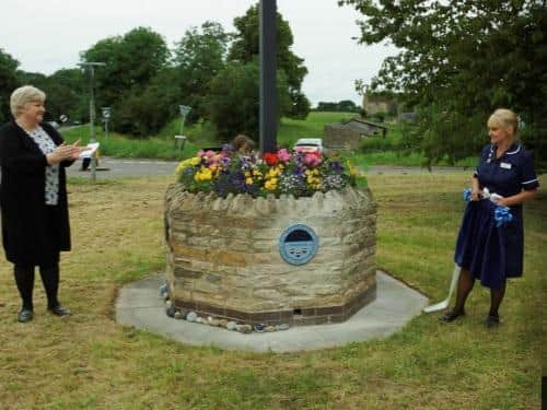 The parish council revealed the plaque alongside a local nurse.