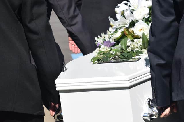 A crematorium has urged families not to leave personal belongings in coffins.