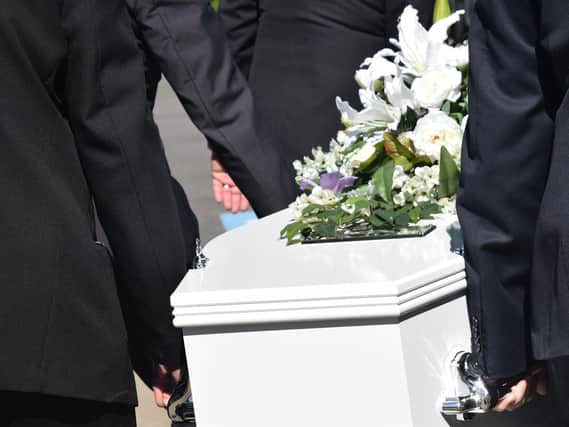 A crematorium has urged families not to leave personal belongings in coffins.
