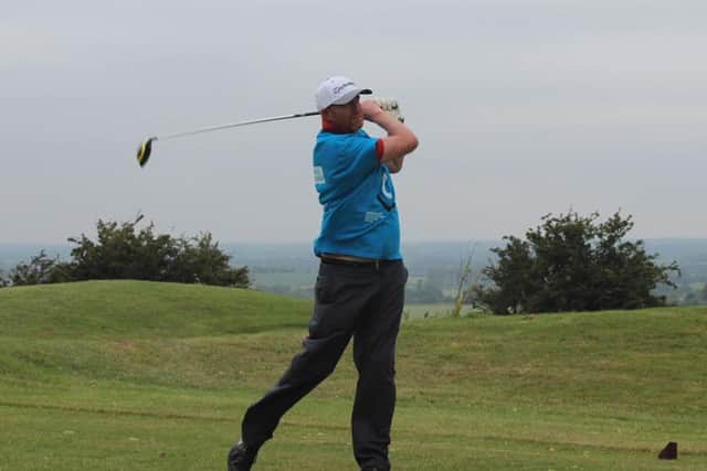 Rich Maber tees off during the Par for Parkinson's event at Cold Ashby Golf Centre