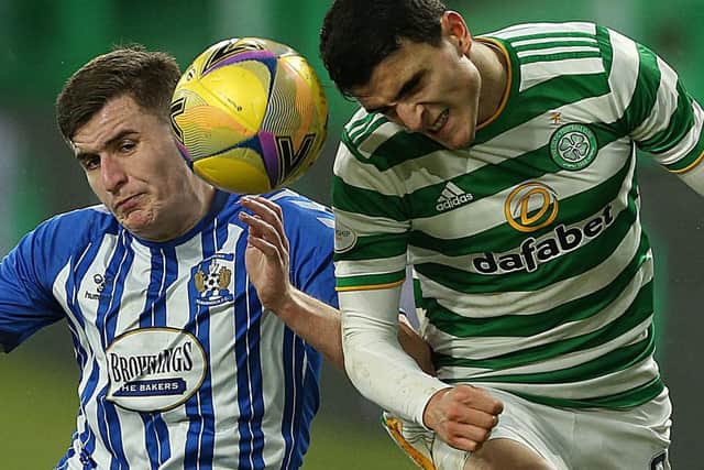 Aaron McGowan, playing for Kilmarnock, challenges for a header with Celtic's Mohamed Elyounoussi in the SPL last season. Picture: Getty.