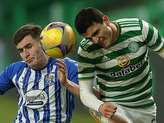 Aaron McGowan, playing for Kilmarnock, challenges for a header with Celtic's Mohamed Elyounoussi in the SPL last season. Picture: Getty.