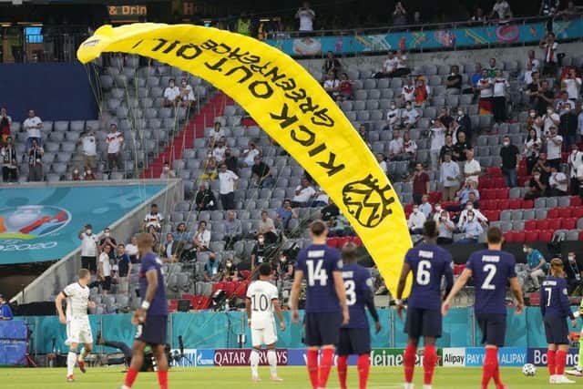 Several people were injured when a protester dropped in ahead of the France-Germany Euro 2020 clash