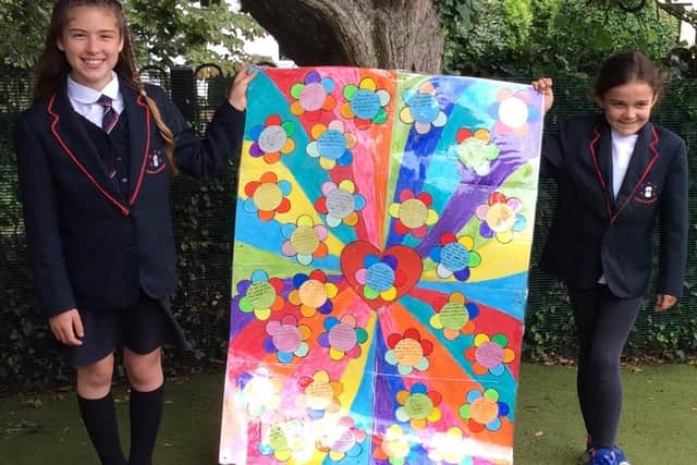 Students show off some of the artwork.