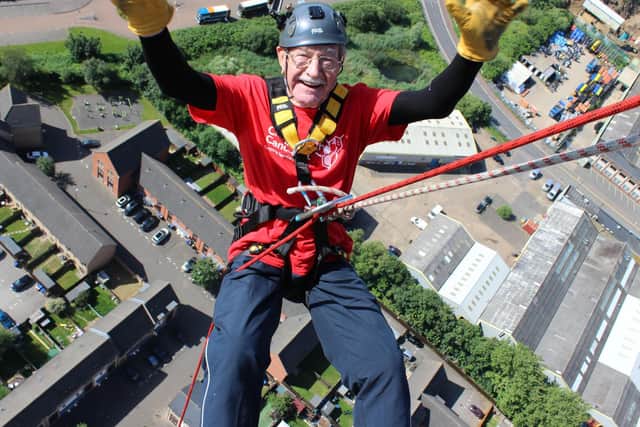 Brian braved no hands for the top of the tower photograph. Photo: Kirsty Edmonds.