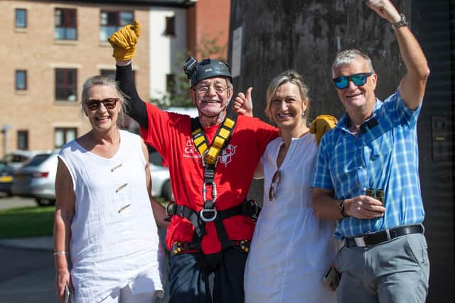 Brian safely on the ground celebrating with friends and family. Photo: Kirsty Edmonds.