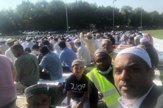 Councillor Enam Haque with his son and other Muslims at Al-Jamatul-Muslimin of Bangladesh Mosque's Eid-al-Adha prayer at Northampton BBOB RFC