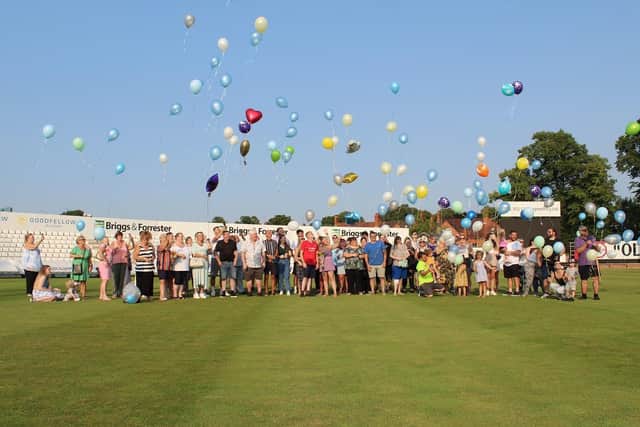 Ashleigh Johnson-Conway and Dean Donnelly's family and friends release balloons at the County Ground to mark the due date of their son, Leo Martin James Donnelly, who was stillborn. Photo courtesy of Ashleigh