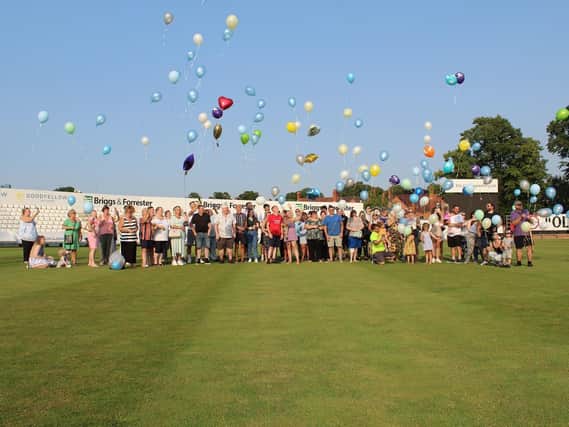Ashleigh Johnson-Conway and Dean Donnelly's family and friends release balloons at the County Ground to mark the due date of their son, Leo Martin James Donnelly, who was stillborn. Photo courtesy of Ashleigh
