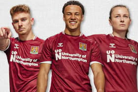 The new Cobblers home shirt modelled by (from left) Sam Hoskins, Shaun McWillams and Abbie Brewin