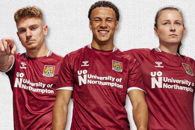 The new Cobblers home shirt modelled by (from left) Sam Hoskins, Shaun McWillams and Abbie Brewin