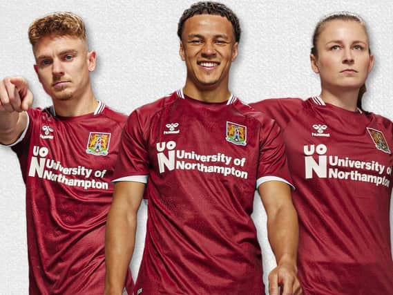 The new Cobblers home shirt modelled by (from left) Sam Hoskins, Shaun McWillams and Abbie Brewin
