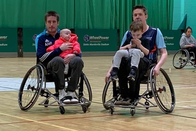 Simon (right) and Michael Nixon with Sienna and Simon's son, Lewis, after a game of wheelchair rugby