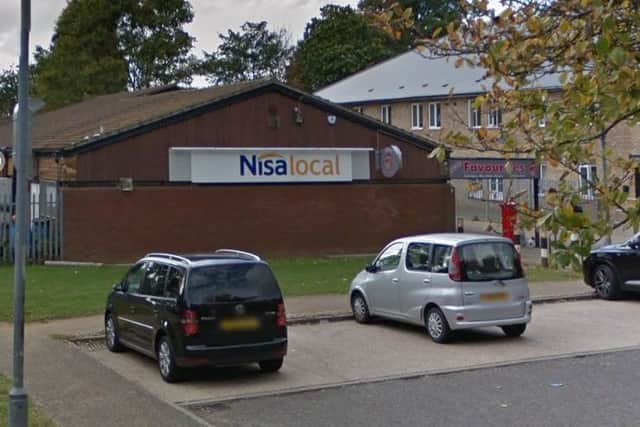 Police are hunting a man who attacked a woman outside this NISA store in Northampton