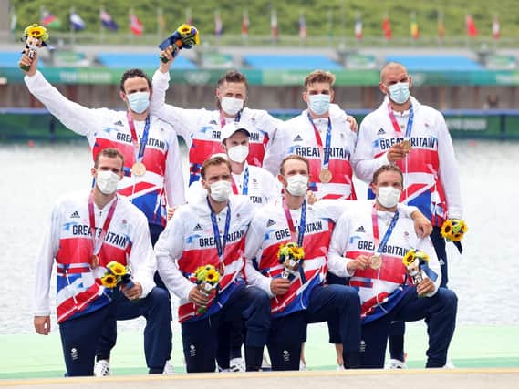 James Rudkin (front row, second from right) and his rowing team won a bronze medal.
