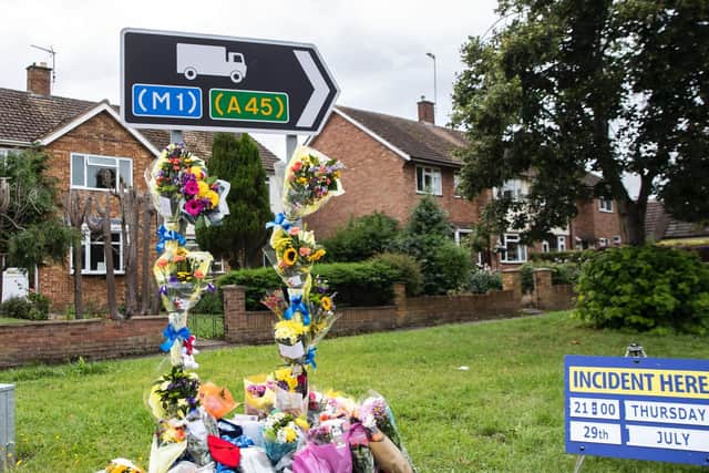 Flowers left at the Harlestone Road junction alongside a police appeal for witnesses following Thursday's fatal crash