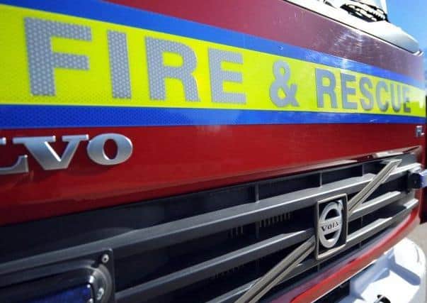 Firefighters used breathing apparatus to force their way into the burning flat