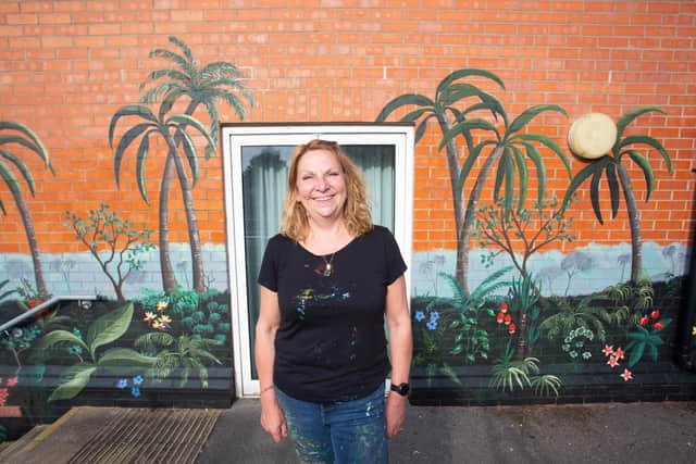 Sarah Hodgkins, of Charlotte Designs, painted the mural at the communal gardens of the flats for Northampton General Hospital staff
