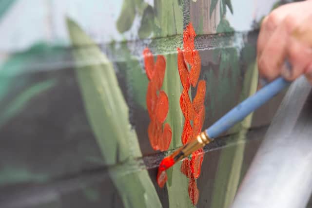 Sarah designed the mural in keeping with the communal garden of the flats for Northampton General Hospital staff, which features tropical flowers and plants
