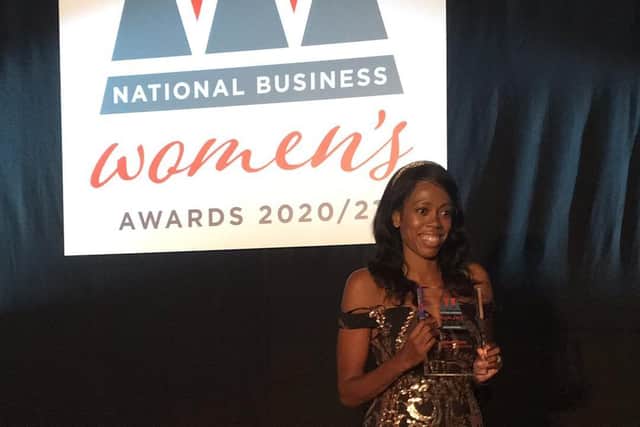 Lorraine Lewis receiving her award.