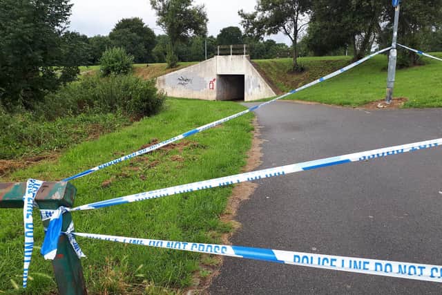 A police cordon is in place.