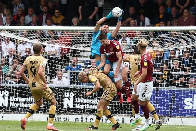 Vale goalkeeper Lucas Covolan claims a cross. Picture: Pete Norton.