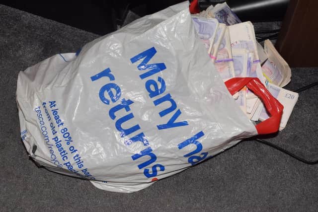 Police who busted the drugs gang found wads of cash stuffed into a shopping bag