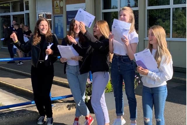 Students at Guilsborough Academy receiving their GCSE results.
