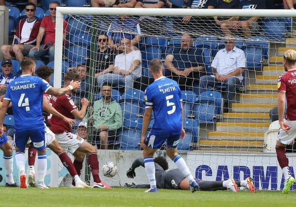 Jon Guthrie scores his first Cobblers goal, poking in at the second time of asking after his initial header was saved. Picture: Pete Norton.