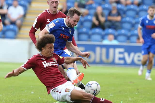 Shaun McWilliams goes in for one of his trademark sliding tackles against Colchester. Picture: Pete Norton.