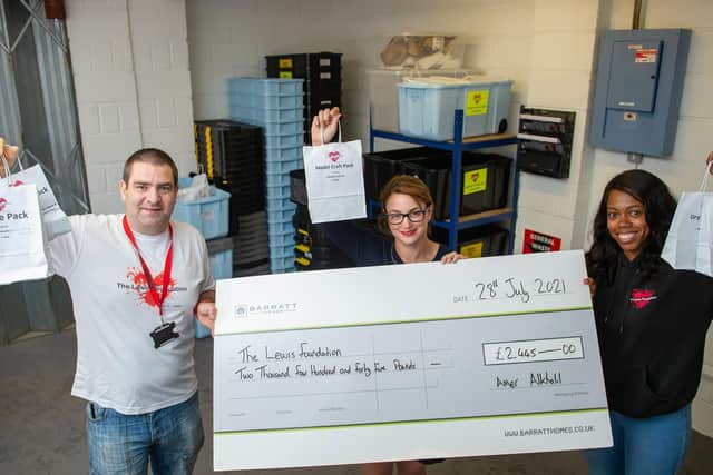 Lee and Lorraine Lewis with Becky Bonnett from Barratt and David Wilson Homes.