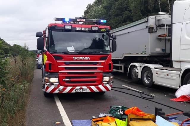 Firefighters worked to free the trapped woman on the A43 near Kettering on Tuesday morning