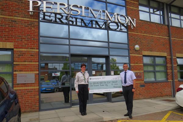 Davina Bowmer from Greens Norton Scout Group receives £1,000 of Building Futures funding from Simon McDonald, Persimmon Homes regional divisional director for Central.