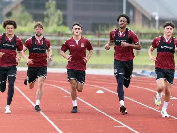 Shaun McWilliams (left), Liam Cross (middle), Caleb Chukwuemeka (second from right) and Scott Pollock (right) have all come through the academy and made first-team appearances in 2021.
