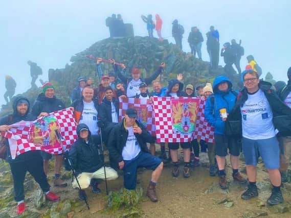 The team climbed Mount Snowdon last weekend.