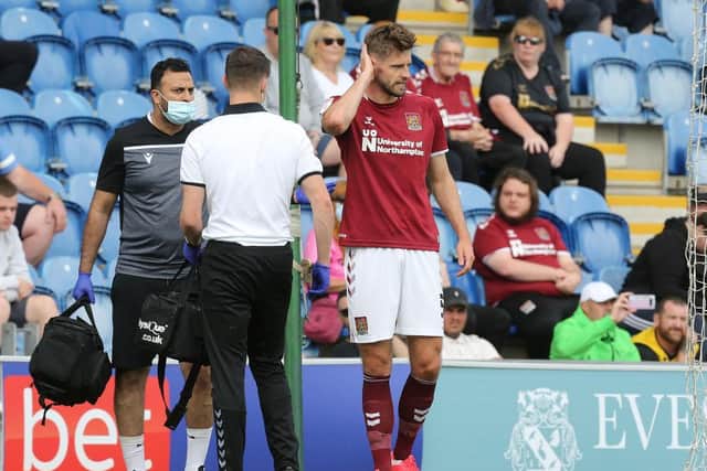 Jon Guthrie is checked over by the medical staff.