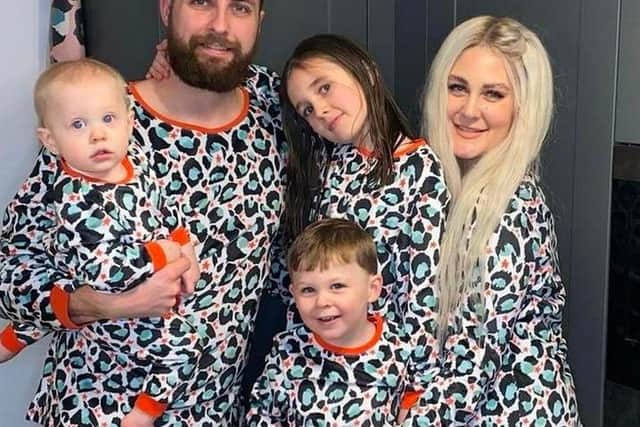 Lizzi, Taylor and their three children.