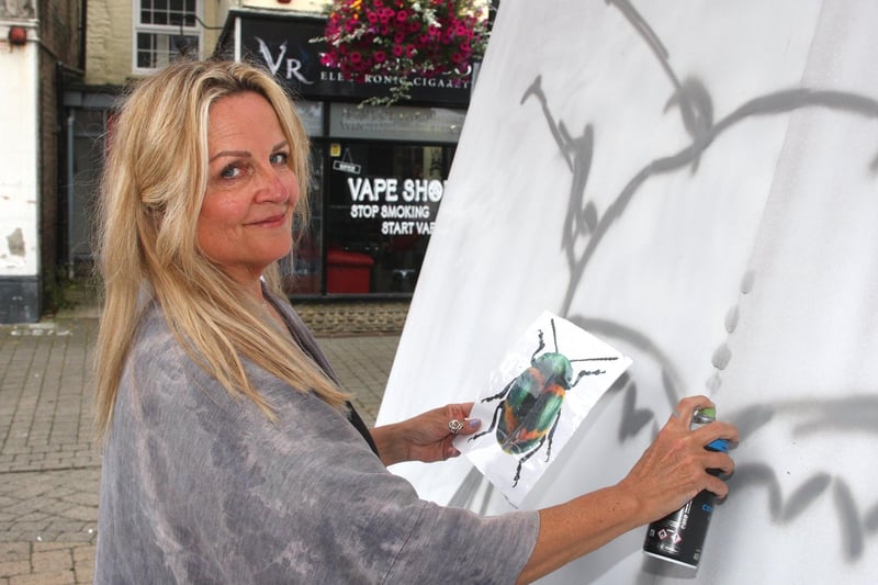 Sarah Gillings taking part in creating the six metre mural for Littlehampton town. Photo by Derek Martin Photography