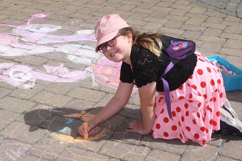 Zoe Pudduck age eight, getting creative with chalk on Littlehampton High Street. Photo by Derek Martin Photography