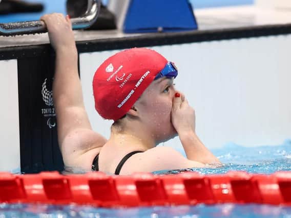 Maisie Summers-Newton realises she has just struck gold, and broke the world record, in Tokyo