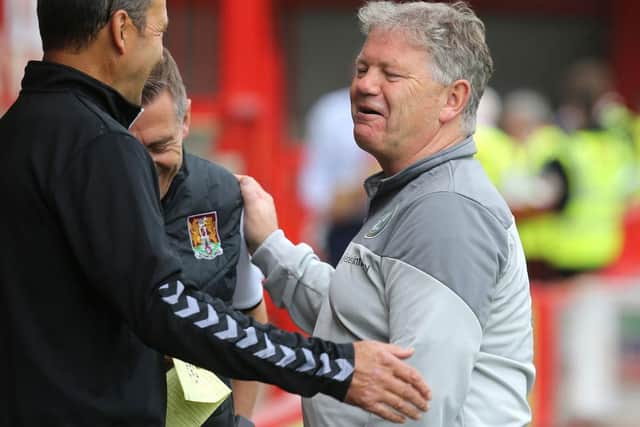 John Yems shares a pre-match joke with Jon Brady and Colin Calderwood. Picture: Pete Norton.